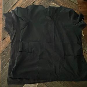 Two black Cherokee scrub tops